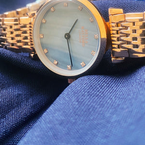 The Kensington. Rose Gold Stainless Steel Strap And Bezel And Blue Mother Of Pearl Dial